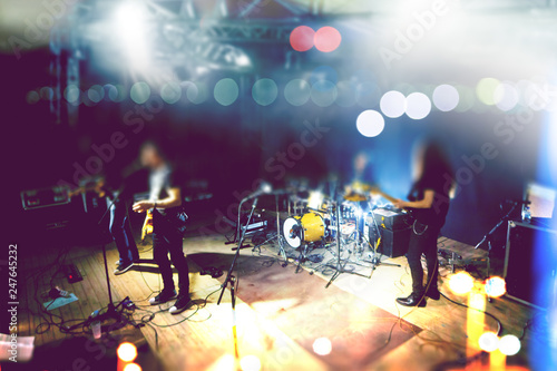  Live music and rock band on stage.Abstract musical background. Playing guitar and music concert concept.