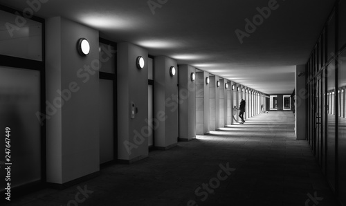 long passage at an office building in black and white, berlin, germany
