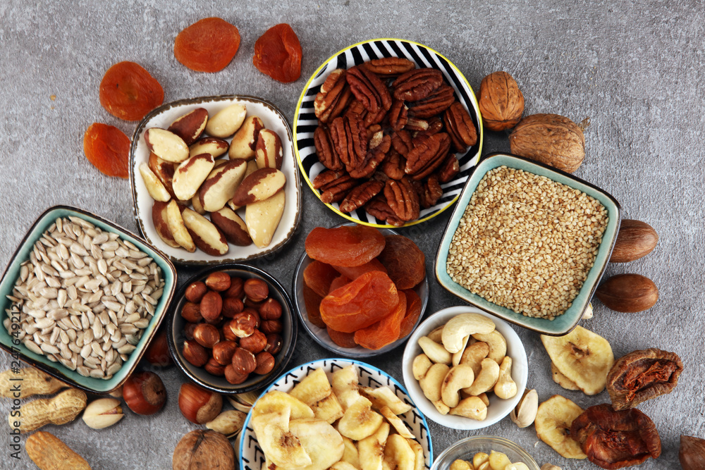 dried fruits and assorted nuts composition on rustic table dried fruits and assorted nuts composition on rustic table