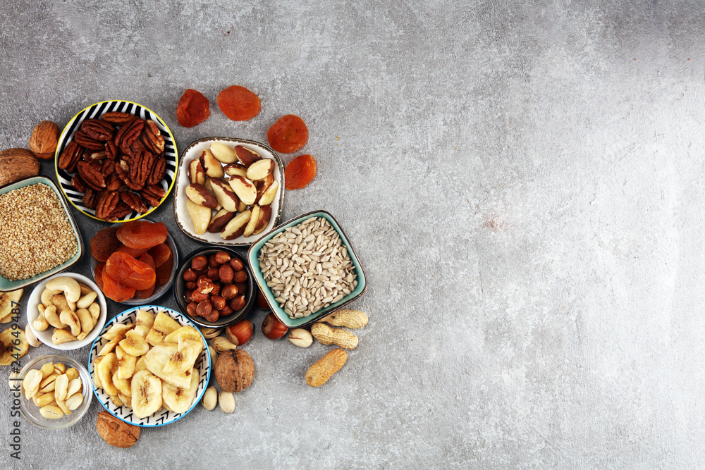 dried fruits and assorted nuts composition on rustic table dried fruits and assorted nuts composition on rustic table