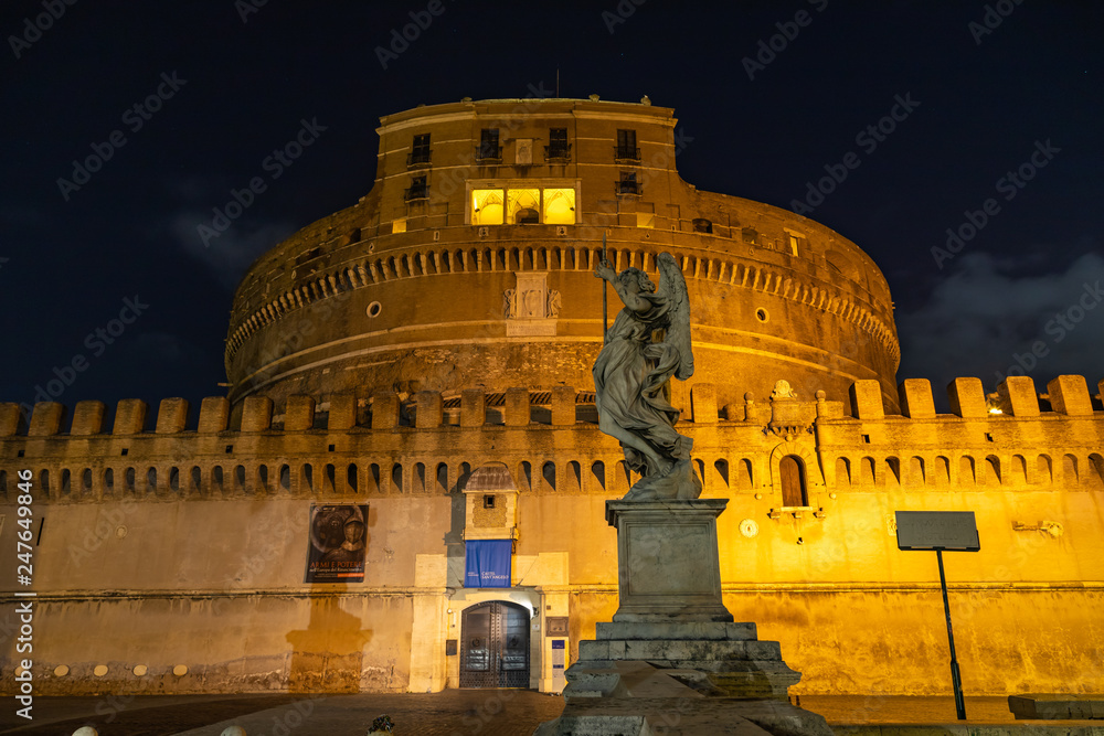 ROME / ITALY - DECEMBER 24, 2018: The magnificent evening view of St. Peter's Basilica in Rome by the Via della ConciliazioneNight view of Castel Sant'Angelo in Rome, Italy.