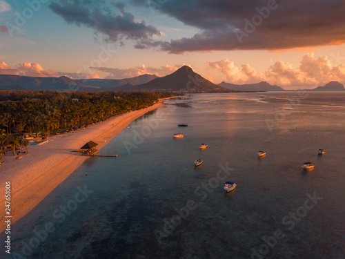 Aerial view of Flic and Flac beach in Mauritius, sunset light. Exotic beach sunset.