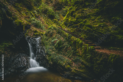 waterfall grotto in deep forest