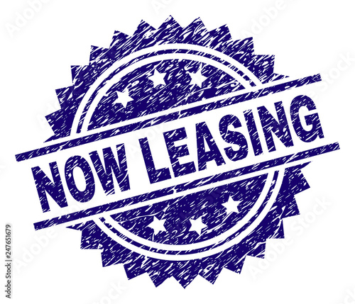 NOW LEASING stamp seal watermark with distress style. Blue vector rubber print of NOW LEASING caption with scratched texture.