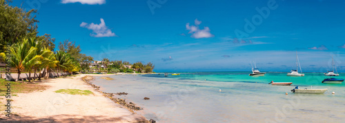 Fototapeta Naklejka Na Ścianę i Meble -  BAIN BOEUF Mauriutius. Beautiful beach in northern Mauritius. Coin de Mire, white sand beach among Palm trees