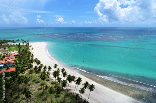 Aerial view of Carneiros’s Beach, Pernambuco, Brazil: Vacation in the paradisiac beach with blue sky and crystal water. Fantastic beach view. Great landscape. Travel scene. Vacation scene