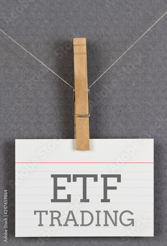 ETF trading written on an index card moored to a clothespin