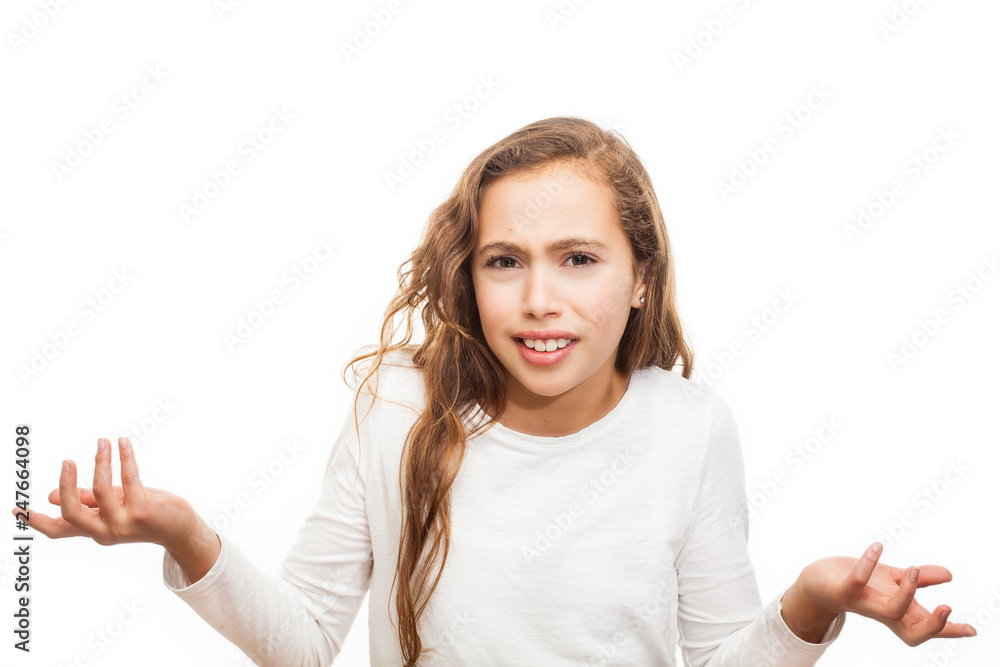 Inquisitive grumpy young girl looking at the camera isolated on white background Inquisitive grumpy young girl looking at the camera isolated on white background