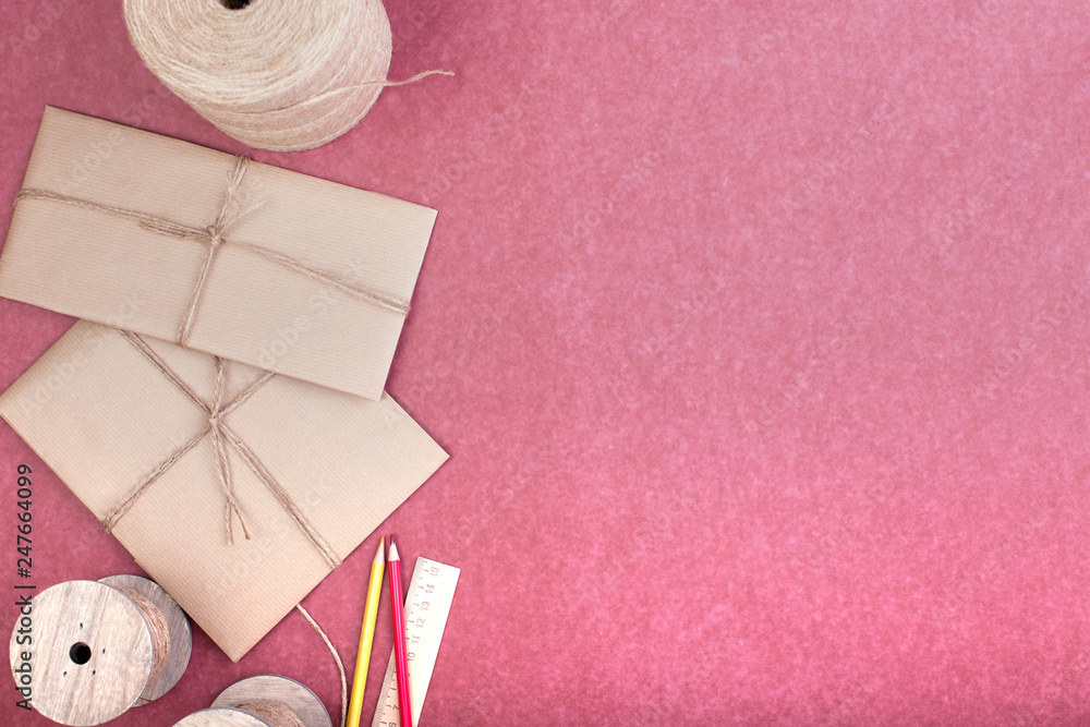Gift wrapping set on pink. A set of items for gift decoration. Flat lay top view Gift wrapping set on pink. A set of items for gift decoration. Flat lay top view