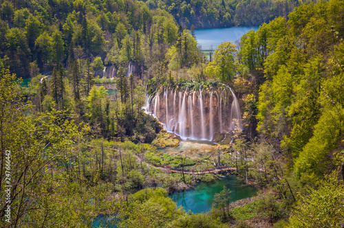 Scenic view of the lovely Veliki Prstavac Waterfall in the heart of upper lakes, Plitvice Lakes National Park, Croatia photo