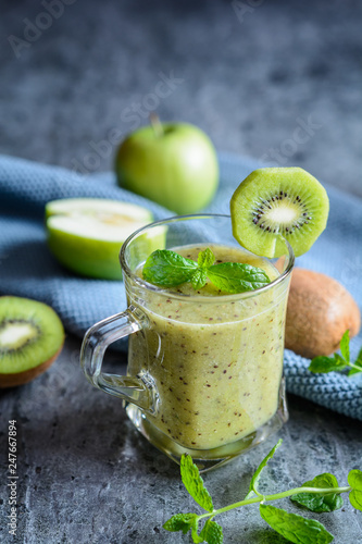 Apple smoothie with kiwi in a glass jar