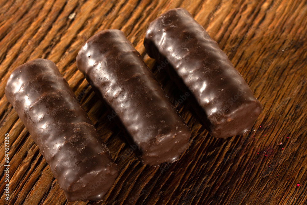 Chocolate candies on a wooden background. Close-up Chocolate candies on a wooden background. Close-up