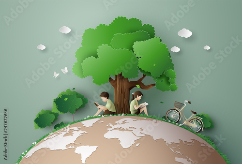 Family with  bicycle Relaxing under Big Tree 