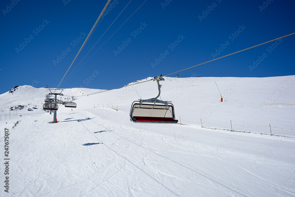 Chair Lift in the Alps with sunshine Chair Lift in the Alps with sunshine