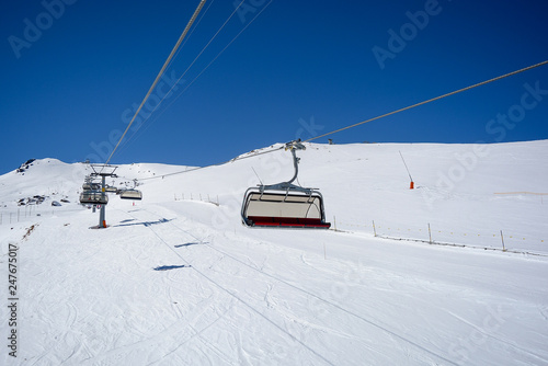Chair Lift in the Alps with sunshine