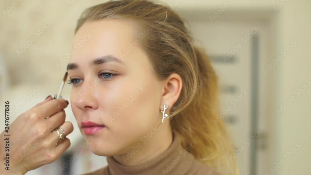 Permanent makeup. Permanent tattooing of eyebrows. Cosmetologist applying permanent make up on eyebrows- eyebrow tattoo. Permanent makeup. Permanent tattooing of eyebrows. Cosmetologist applying permanent make up on eyebrows- eyebrow tattoo.