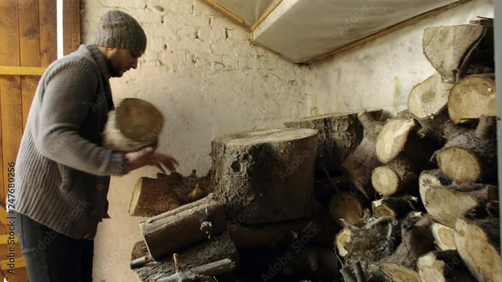 Man taking wood from old barn Man taking wood from old barn