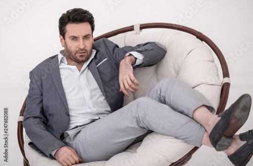 close up.tired businessman resting in a comfortable chair