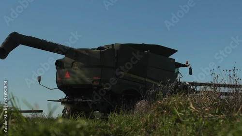 Footage of a tractor on a wheat farm. photo