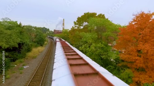 Aerial shot of train traveling in Pittsburgh on fall day photo