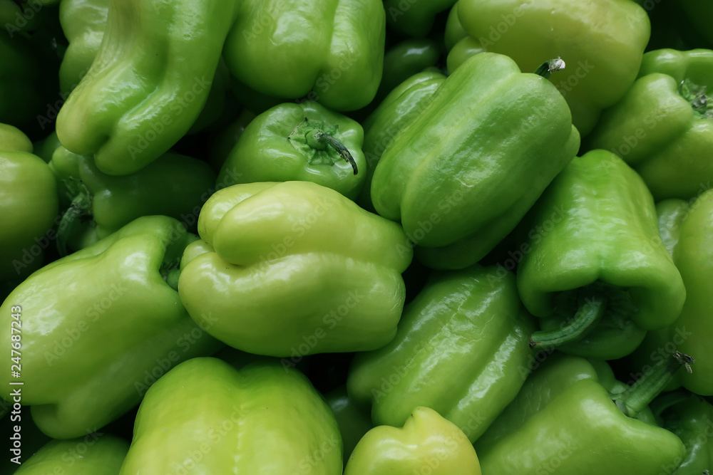 Many scattered ripened green pepper fruits in the store Many scattered ripened green pepper fruits in the store