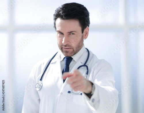attentive doctor pointing finger at you