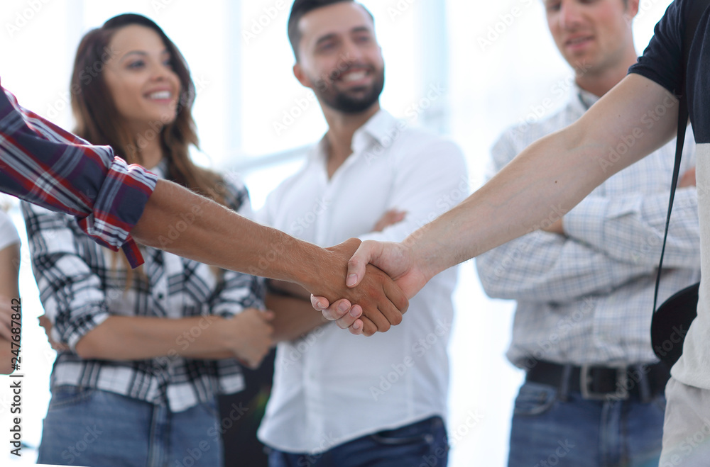 closeup of handshake of business partners closeup of handshake of business partners