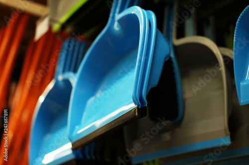 Plastic household scoops in store