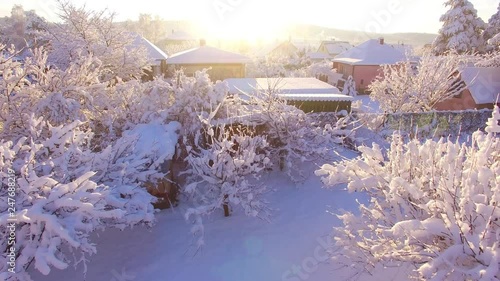 Aerial view to snowy village in Western Bohemia. Winter on Countryside. Lhota suburb of Pilsen city, Czech Republic, Europe.  photo