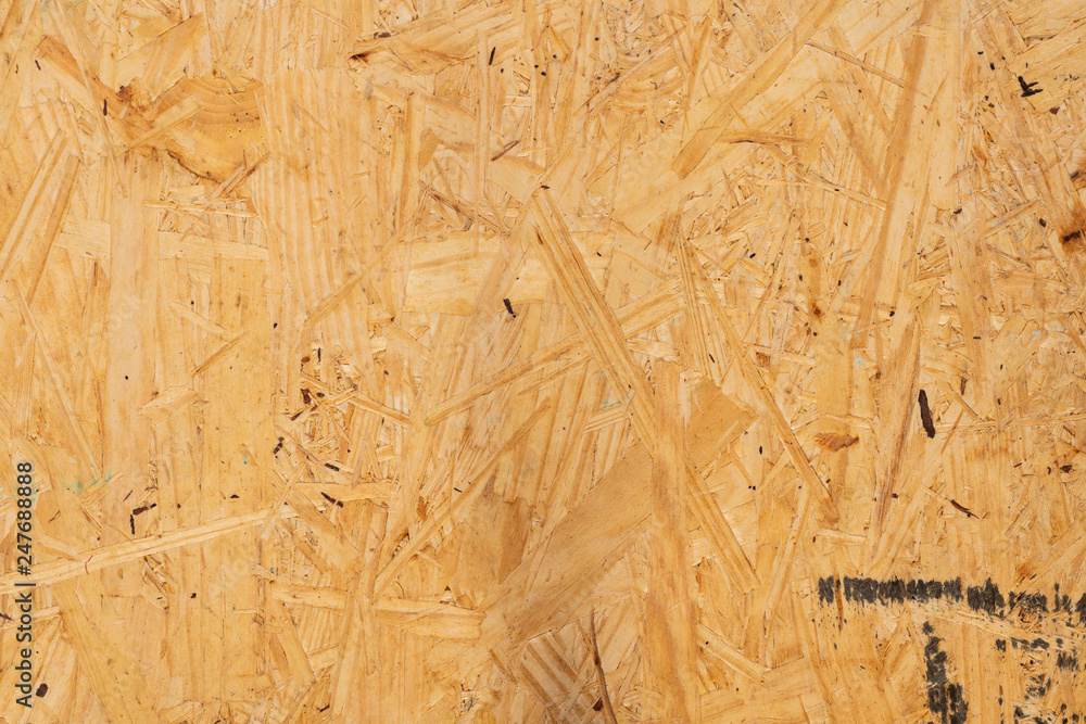 Close up of sub flooring board made of wood chips background Close up of sub flooring board made of wood chips background