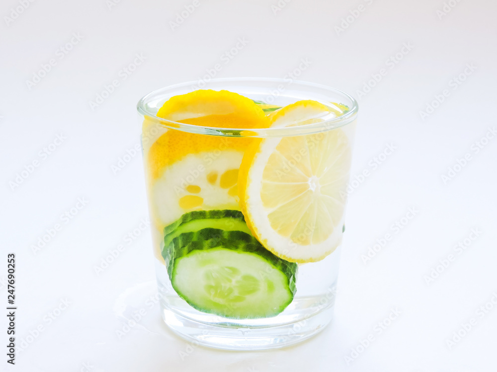 Food for fitness, healthy lifestyle frame flat lay with cucumber and lemon. With space for your text.Infused detox water with cucumber, lemon. cucumber and lemon water.Slimming and excretion of slag. Food for fitness, healthy lifestyle frame flat lay with cucumber and lemon. With space for your text.Infused detox water with cucumber, lemon. cucumber and lemon water.Slimming and excretion of slag.