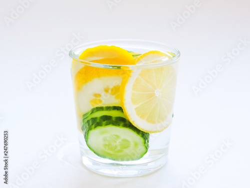 Food for fitness  healthy lifestyle frame flat lay with cucumber and lemon. With space for your text.Infused detox water with cucumber  lemon. cucumber and lemon water.Slimming and excretion of slag. 