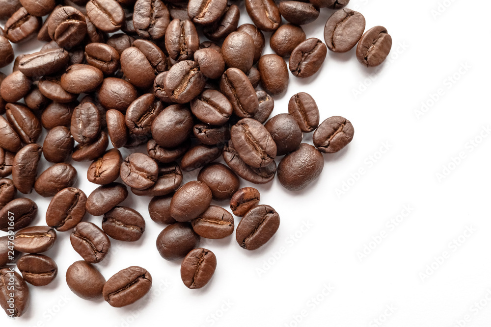 Roasted coffee beans isolated on white background. Close-up. Roasted coffee beans isolated on white background. Close-up.