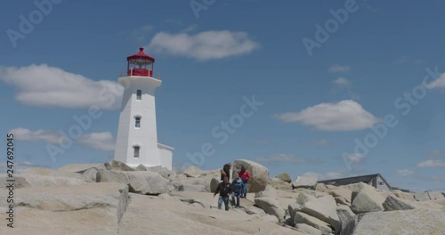 Time lapse footage of the famous Peggy's Cove lighthouse in Nova Scotia, Canada on a perfect, sunny, spring day photo