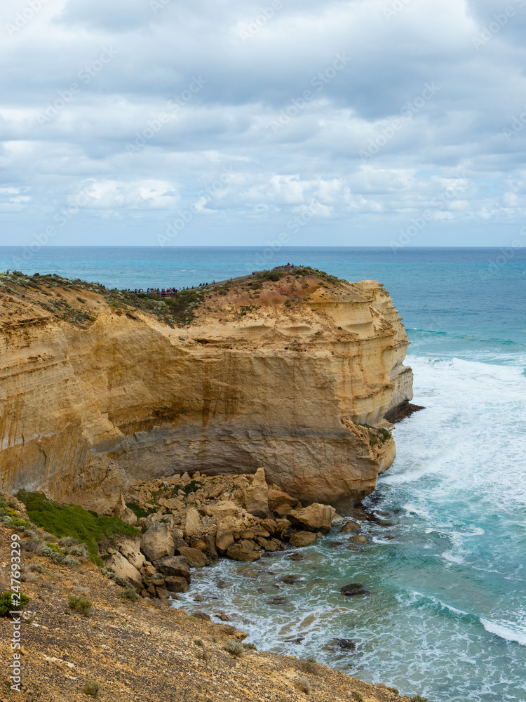 Rock cliff towards the vast ocean. Great Ocean Road, VIC, Australia.