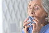 Close up portrait of sick senior woman