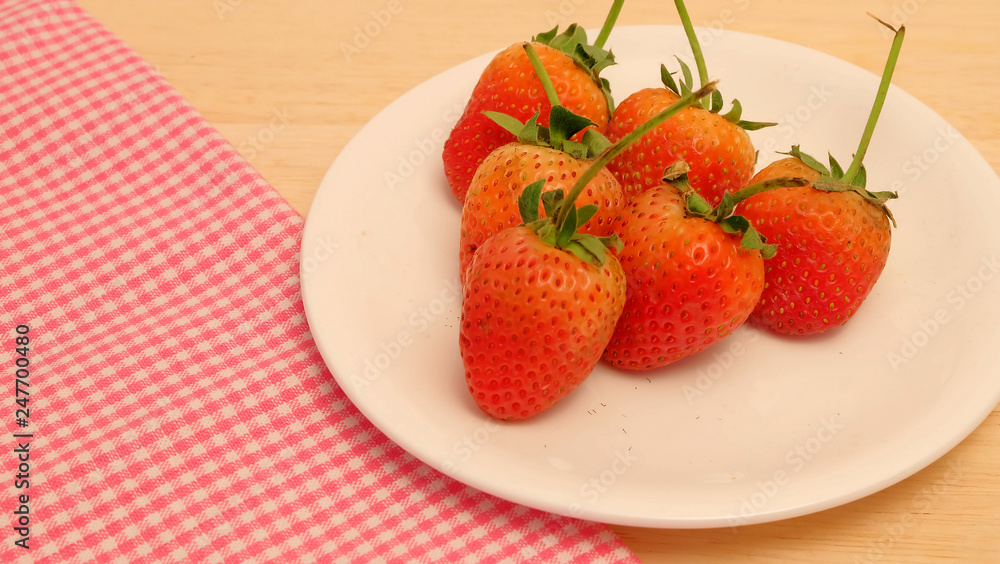 Strawberry on wood table and space for write wording, sweet romantic fruit for special person in special days, lovers in Valentine day, make many dessert menu or juice or dairy strawberry flavor Strawberry on wood table and space for write wording, sweet romantic fruit for special person in special days, lovers in Valentine day, make many dessert menu or juice or dairy strawberry flavor