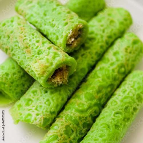 Malaysian's local food , Kuih Lenggang or Kuih Ketayap shoot indoors with flash photo