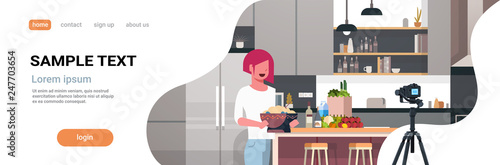 girl food blogger recording video on camera woman preparing tasty dish modern kitchen interior cooking blog concept female character portrait flat copy space horizontal