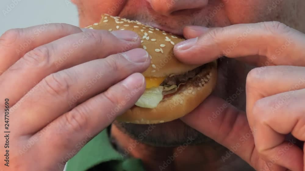 mouth lips man eating a tasty hamburger. mouth lips man eating a tasty hamburger.