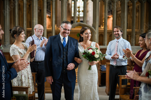 Father of the bride walking his daughter down the aisle