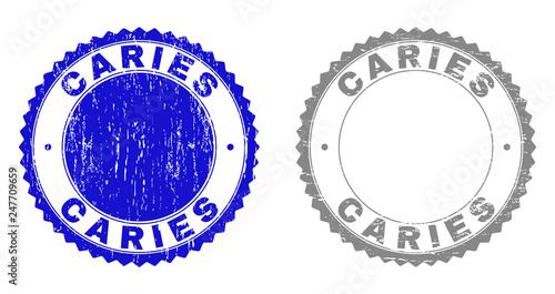 Grunge CARIES stamp seals isolated on a white background. Rosette seals with grunge texture in blue and grey colors. Vector rubber imitation of CARIES label inside round rosette. photo