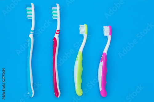 Toothbrushes on colorful bright background. Family hygiene concept.