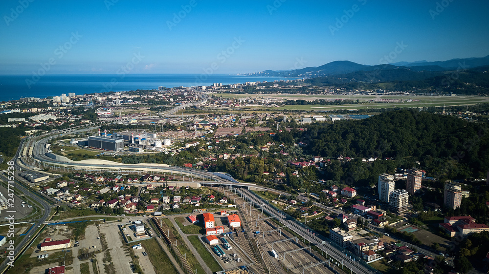 Adler, Sochi, Russia - December 10, 2018: The airdrome of Sochi International Airport with planes on the background of mountains in sunny day