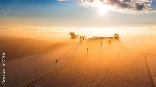 Italy - Fog. Flying over the evening timelapse clouds with the late sun. Flight through moving cloudscape with beautiful sun rays. Drone photo above very thick clouds foggy sunrise.