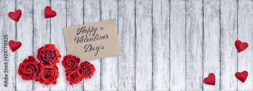 Banner with red roses, Valentines card, velvet hearts and place for your text on background of shabby wooden planks in rustic style