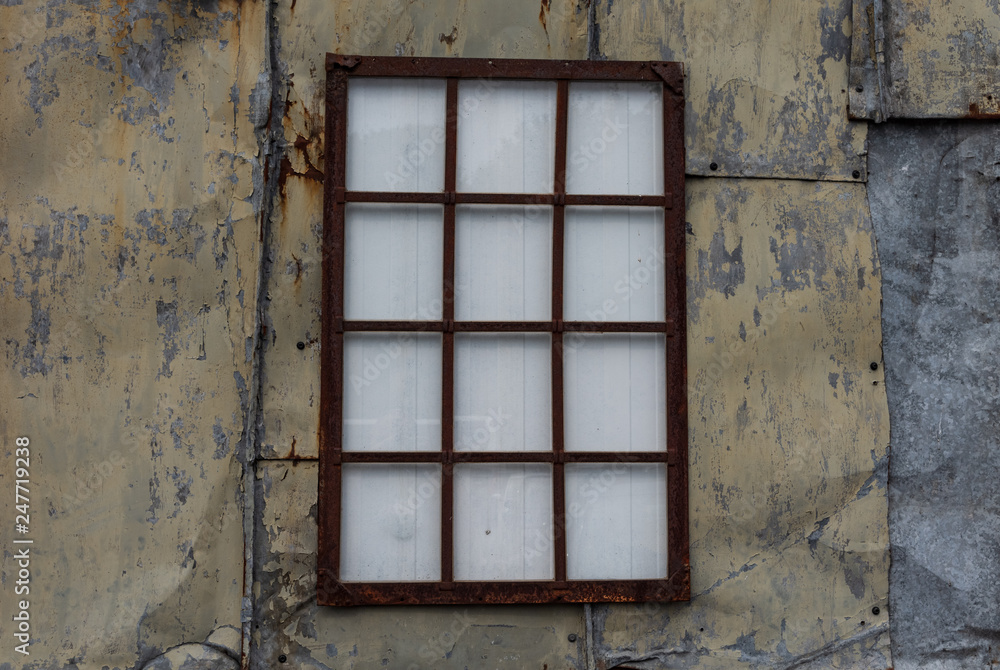 Fototapeta premium The old iron wall of a building