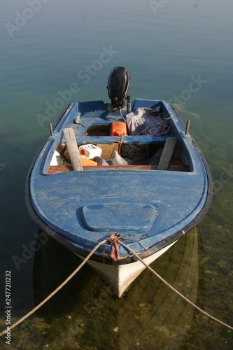 A wooden rowing boat tide down