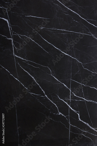 The texture of natural stone is black marble with patterns and white stripes, the stone is called Nero Marquina