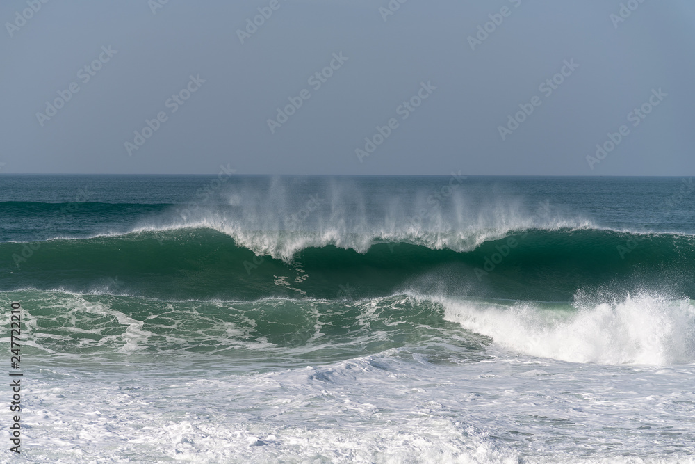 Atlantic ocean waves by Nazare North beach,  Portugal.